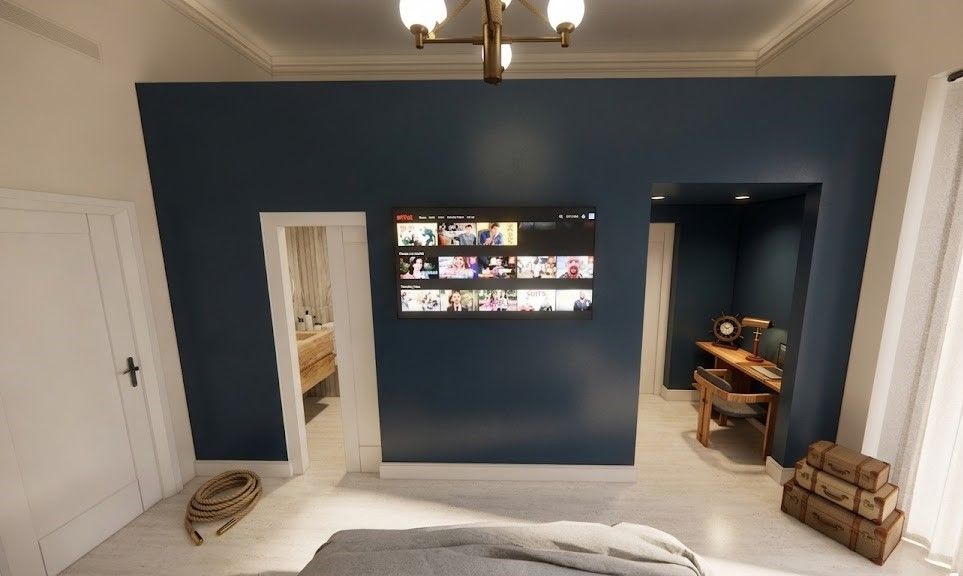 Camera Duomo: parete blu notte con smart TV e zona scrivania