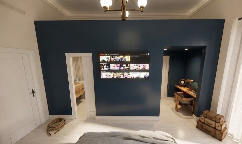 Camera Chiaia: parete blu notte con televisore e zona scrivania